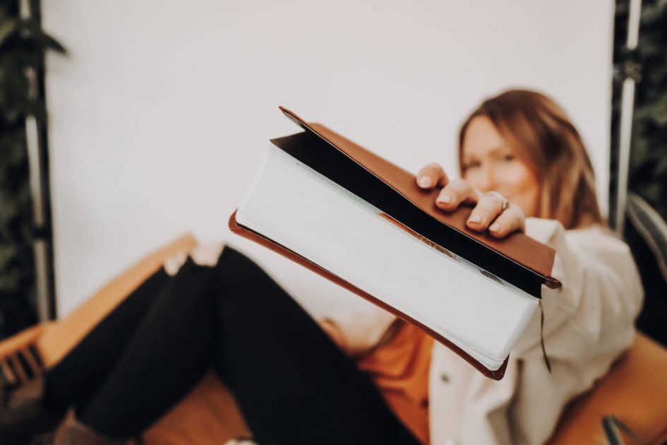 Lady passing a bible